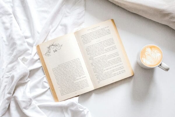 open book with mug on study desk