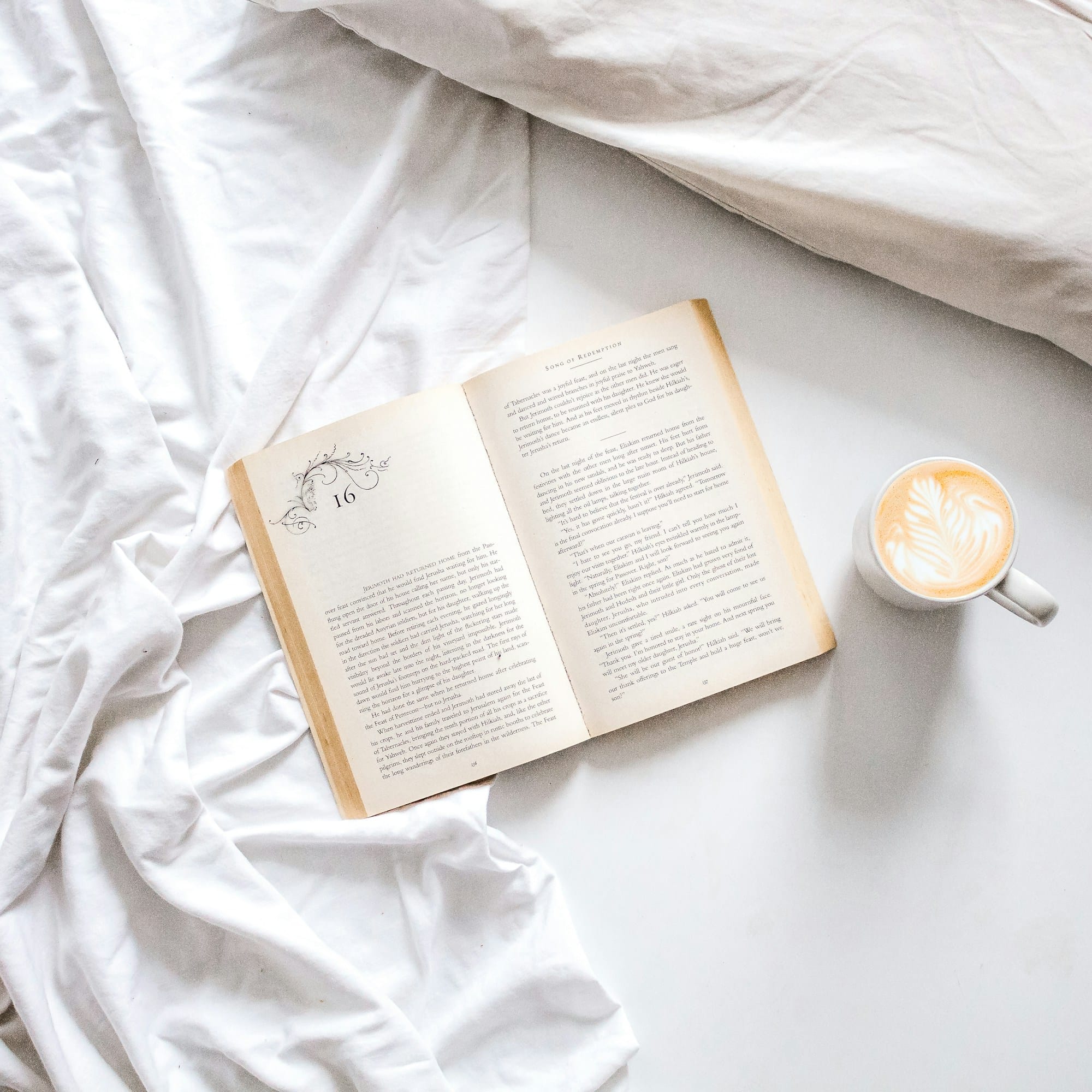 open book with mug on study desk